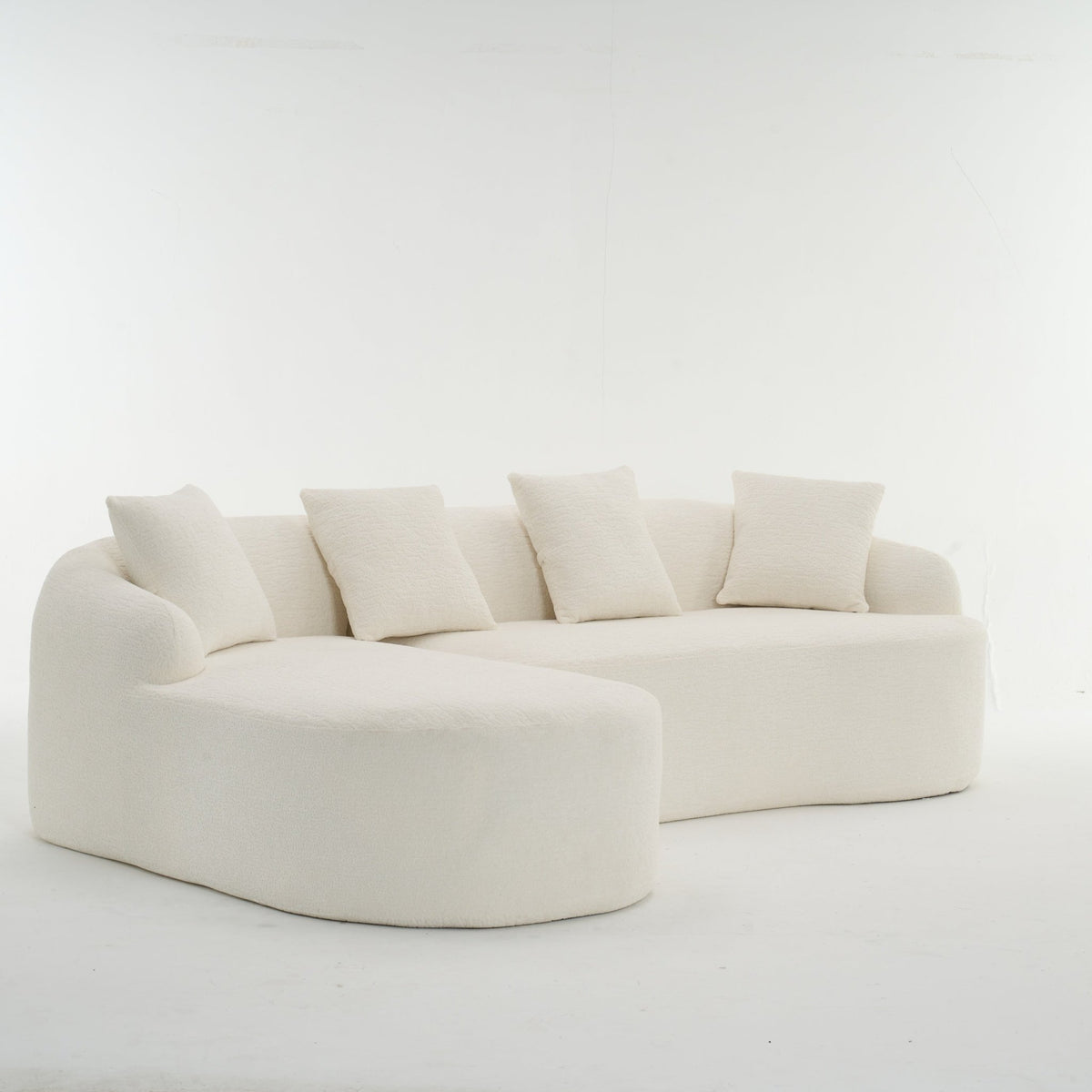 Anthony & Home Heritage Collection L-shaped sectional sofa with curved chaise in elegant minimalist design, shown from a side view.