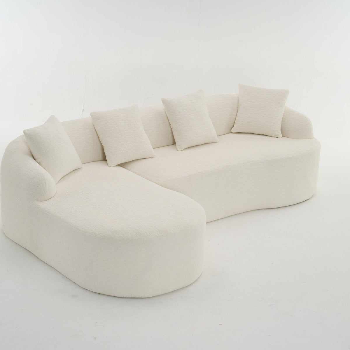 Anthony & Home Heritage Collection L-shaped sectional with curved chaise, sleek minimalist design, upholstered in neutral fabric.