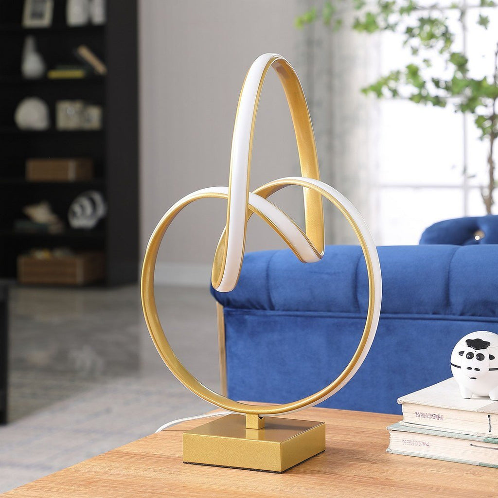 Infinity matte gold table lamp with LED lighting from Anthony & Home, featuring a sleek modern design for contemporary interiors.