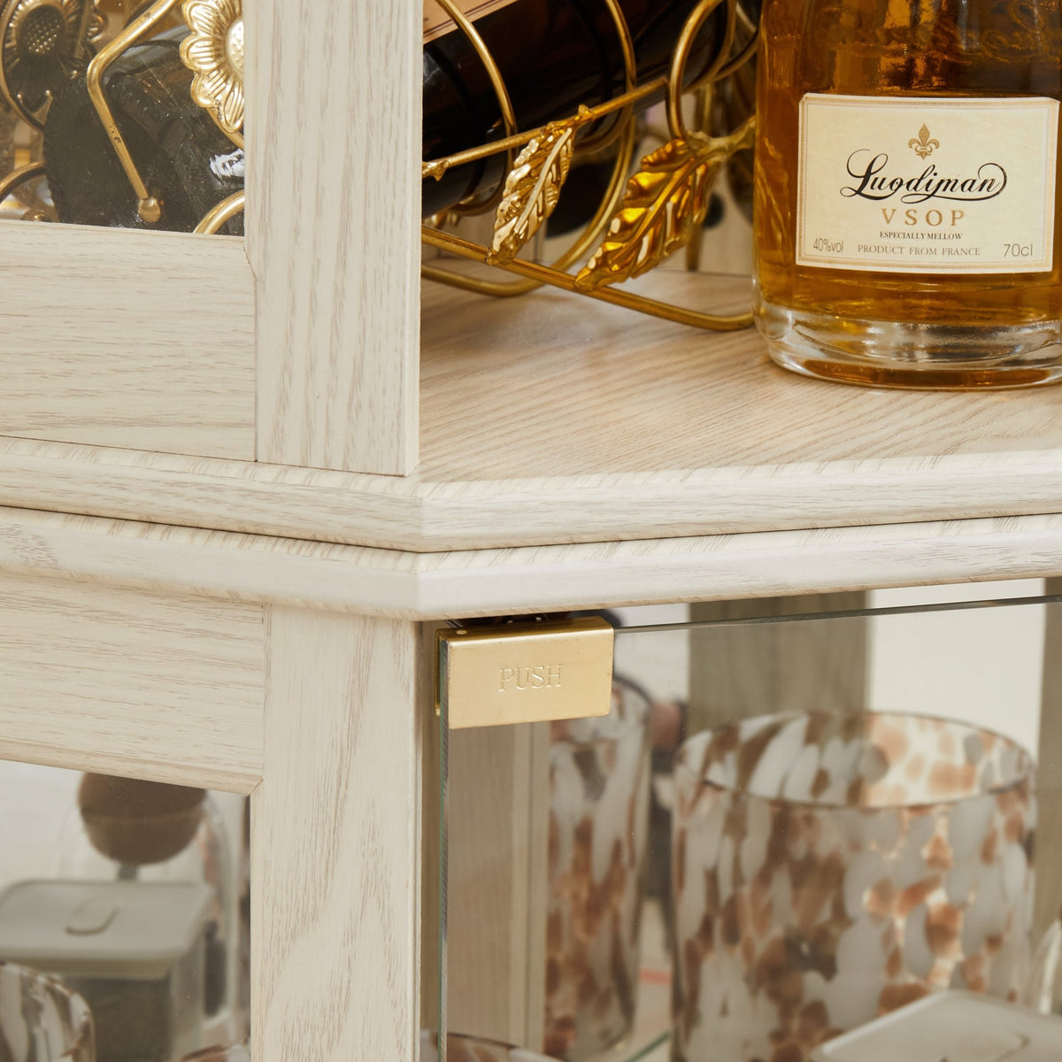 Lighted Anthony & Home curio cabinet with a curved silhouette, limited edition display case for collectibles or decorative items.