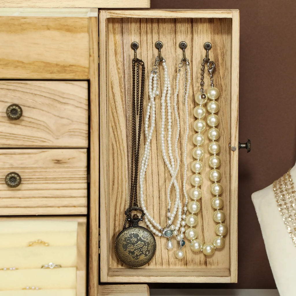 Limited edition Atelier Paulownia wood jewelry box by Anthony & Home with intricate carved details and a polished finish.