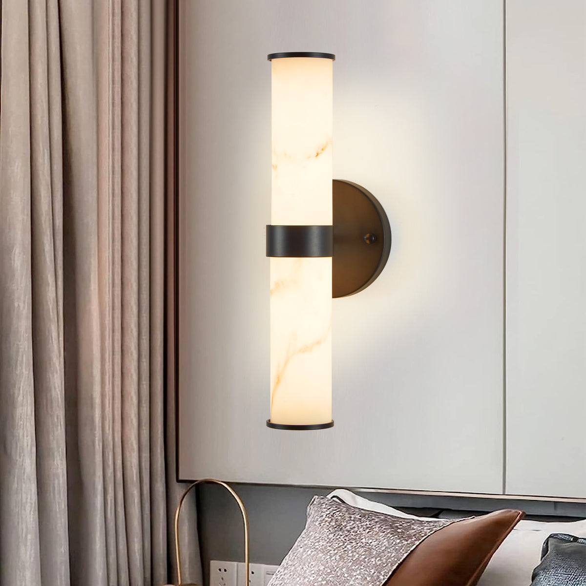 Pair of Atelier resin marble wall sconces in matte black iron frames, designed by Anthony & Home for stylish lighting decor.