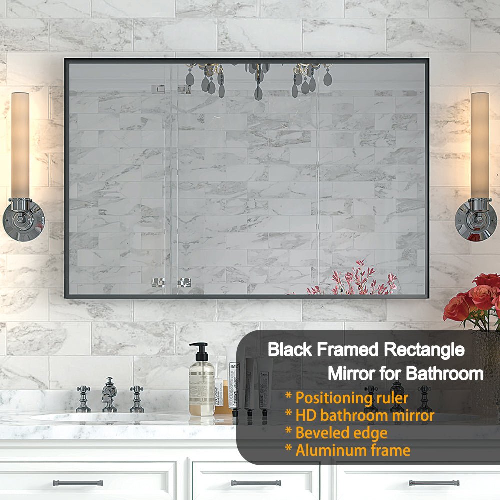 Limited edition black aluminum bathroom mirror from Anthony & Home, sleek rectangular design with reflective glass surface.
