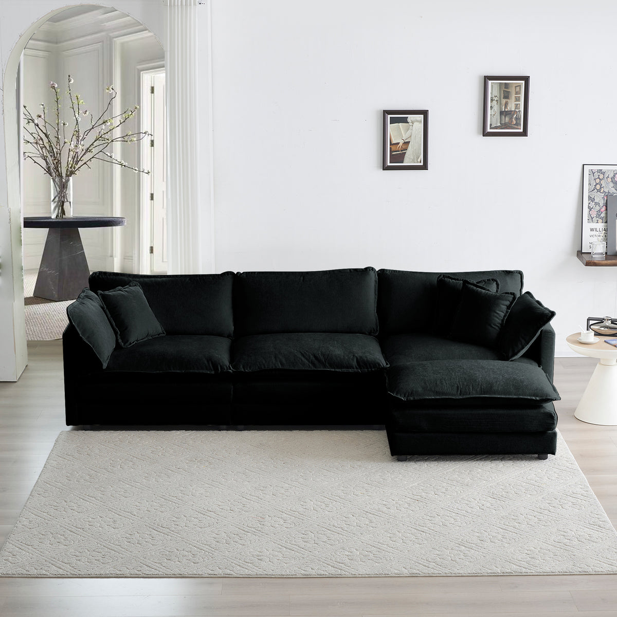 Anthony & Home limited edition black chenille oversized L-shaped sectional sofa with reversible ottoman, showing plush upholstery and modern design.