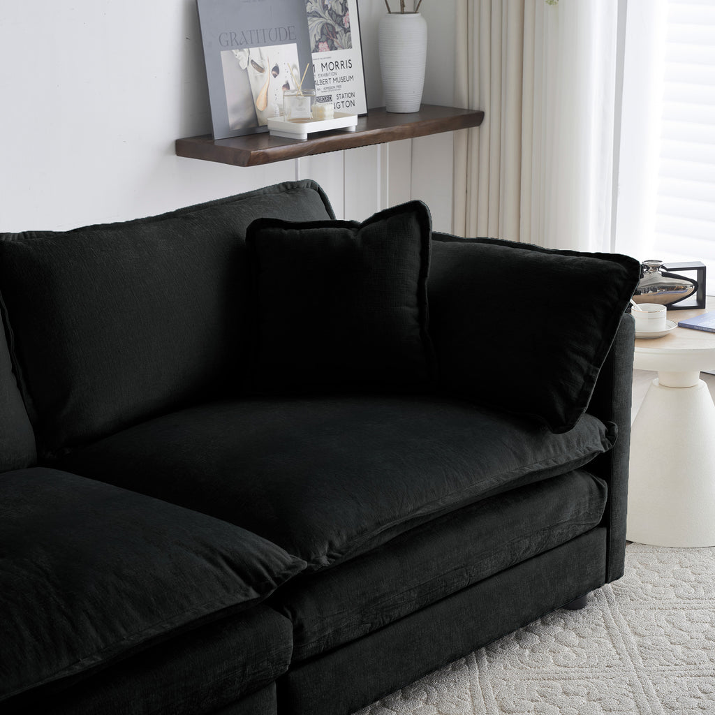 Limited edition black chenille oversized sectional sofa with modular L-shape and reversible ottoman by Anthony & Home.
