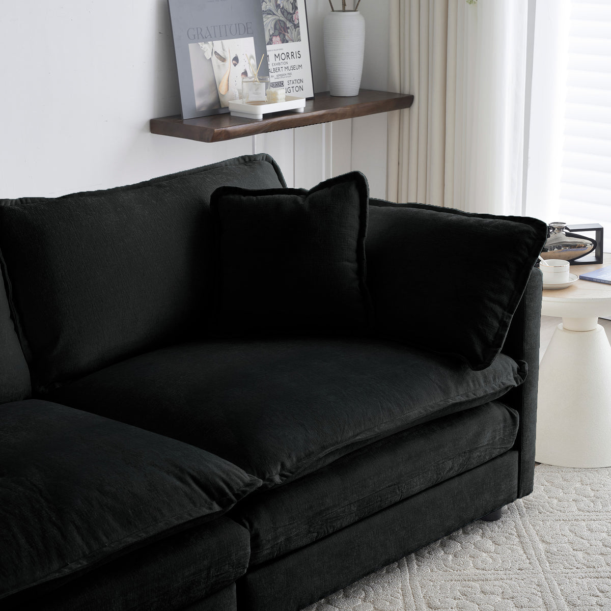 Limited edition black chenille oversized sectional sofa with modular L-shape and reversible ottoman by Anthony & Home.