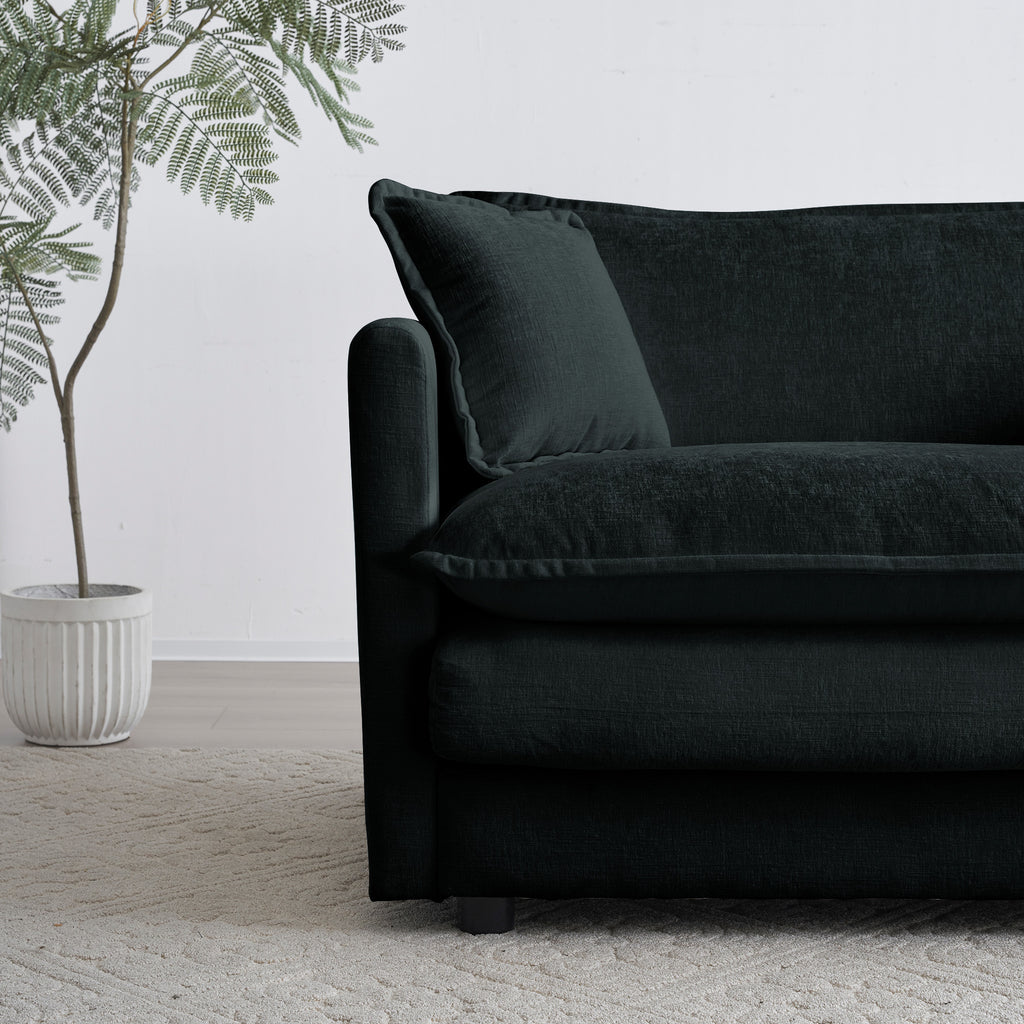 Black chenille oversized sectional sofa with modular L-shape and reversible ottoman by Anthony & Home, showing plush seating and contemporary design.