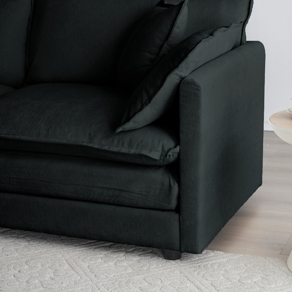 Anthony & Home limited edition black chenille oversized modular L-shaped sectional with reversible ottoman in a stylish living room setting