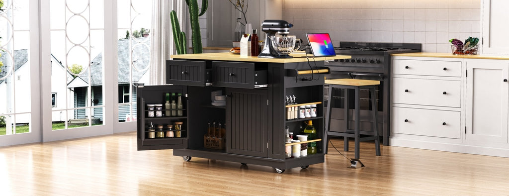 Matte black kitchen island with drop leaf, limited edition by Anthony & Home, featuring a spacious tabletop and storage drawers.