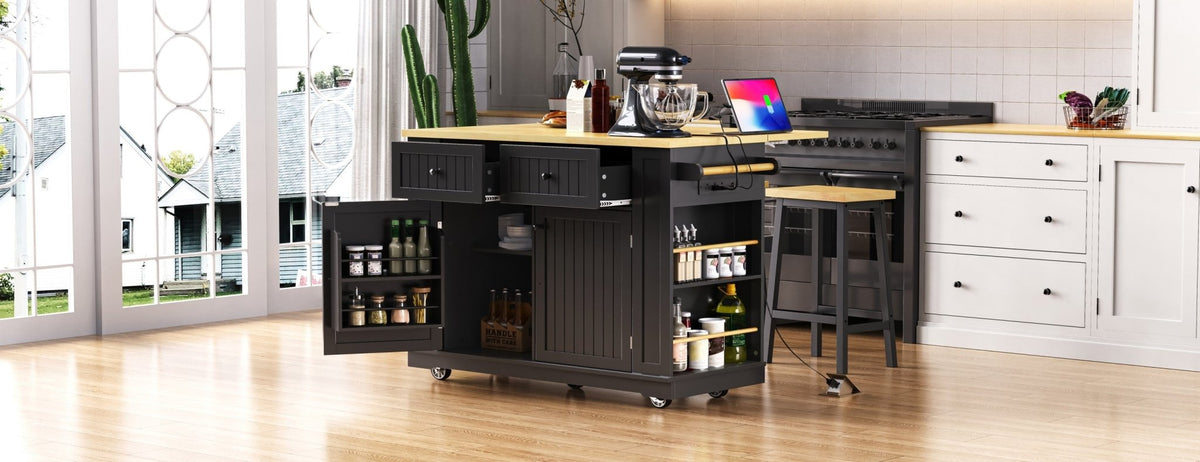 Matte black kitchen island with drop leaf, limited edition by Anthony & Home, featuring a spacious tabletop and storage drawers.