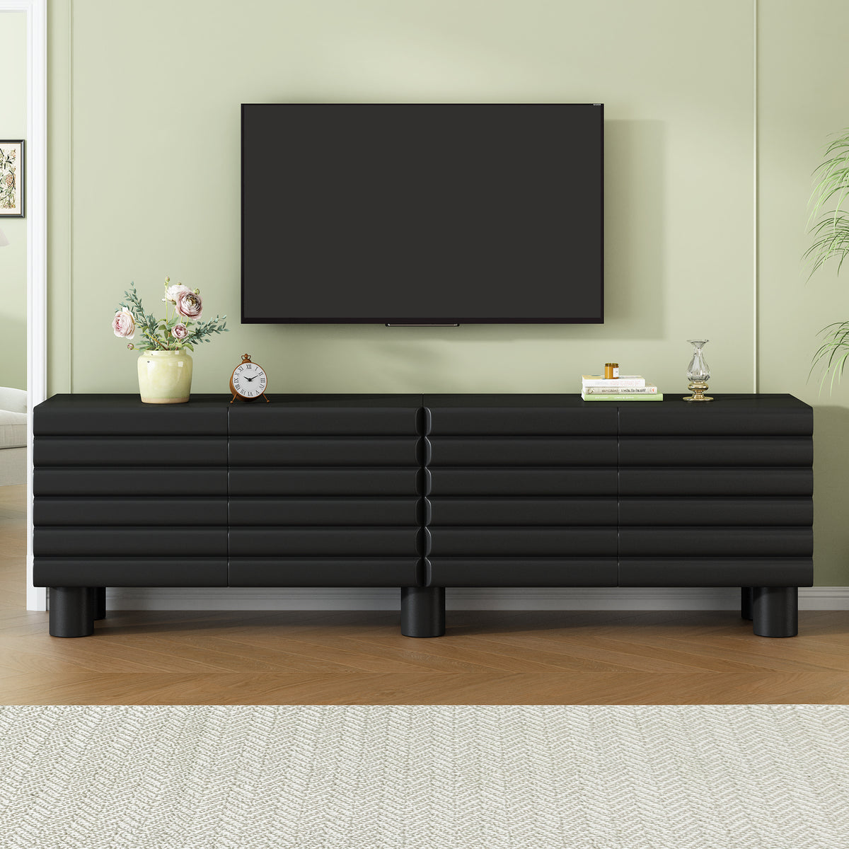Limited edition matte black MDF media console with cylindrical legs, suitable for 75-inch TVs by Anthony & Home.