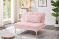 Pink teddy fabric convertible sofa bed with eucalyptus wood frame, showing its plush surface and compact, versatile design in a studio setting.