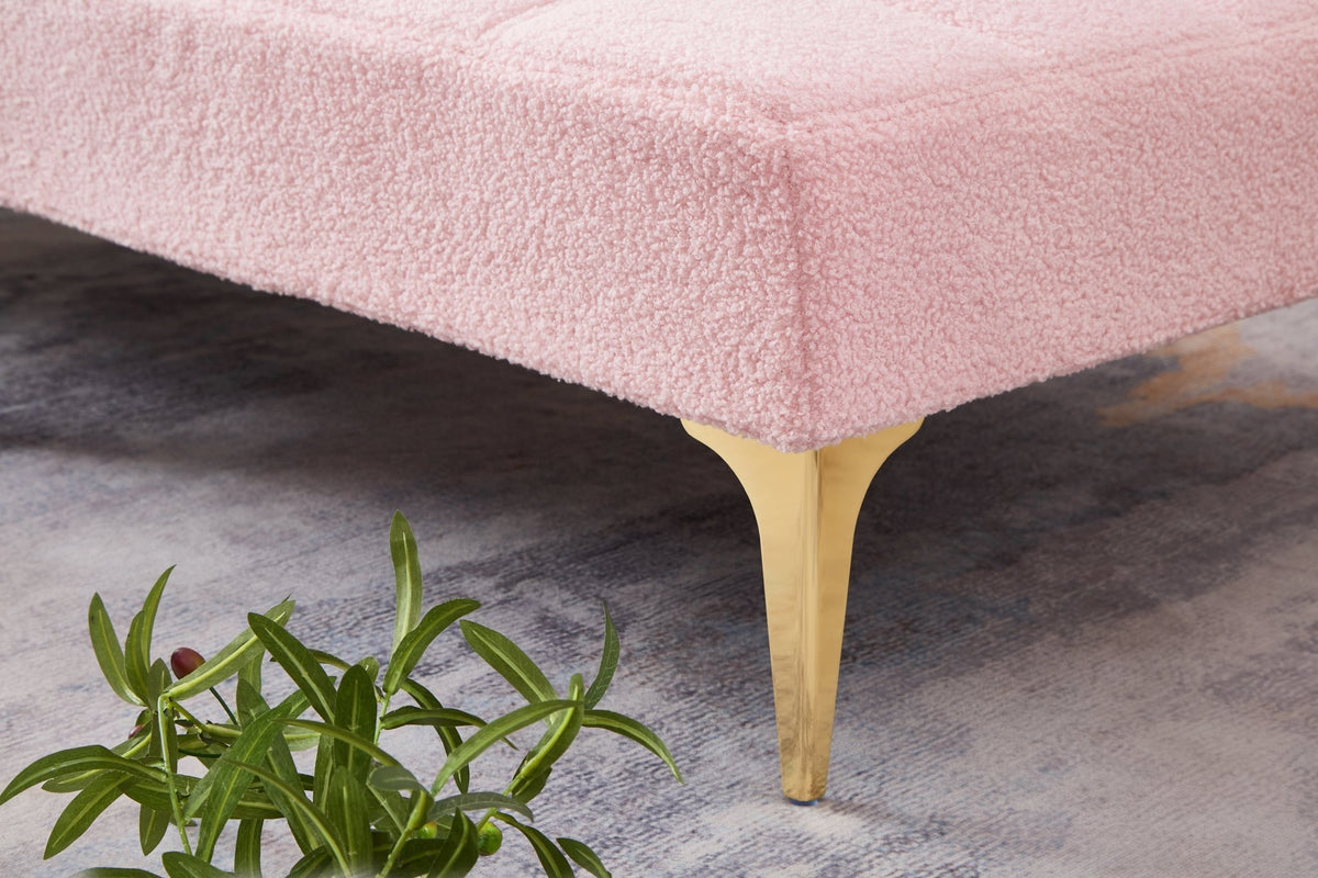 Limited edition pink teddy fabric convertible sofa bed by Anthony & Home with solid eucalyptus wood frame in a modern studio setting