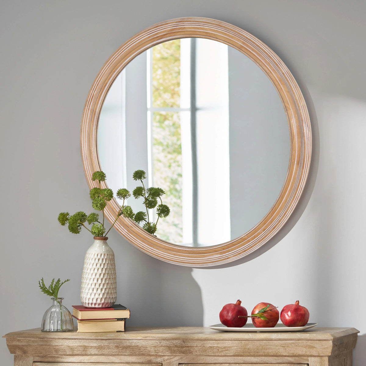 Round wall mirror with whitewash wood frame from Anthony & Home, showcasing a stylish, rustic design for modern interiors.