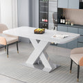 Rectangle dining table with X-shaped steel base by Anthony & Home, showcasing a sleek wooden tabletop and modern industrial design.