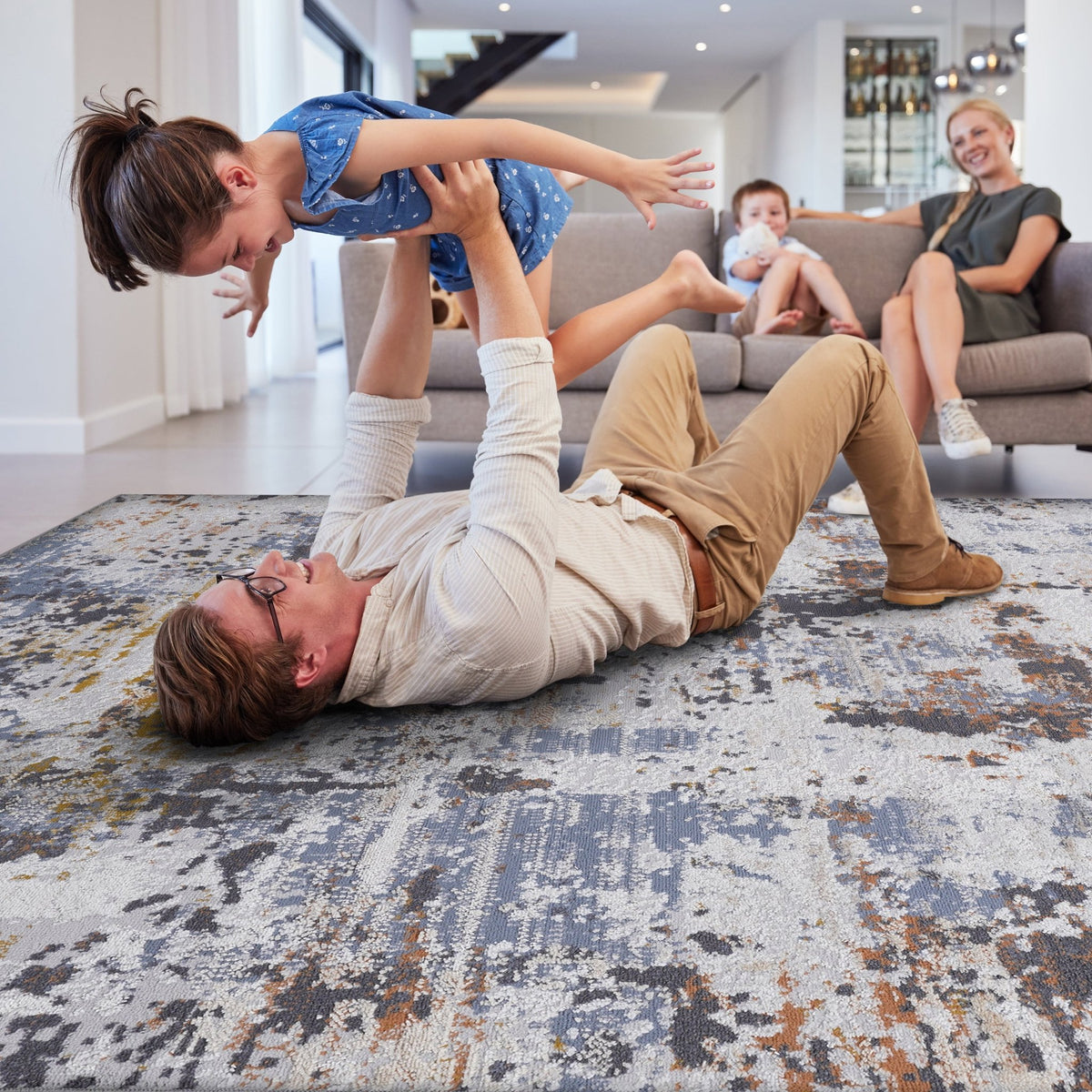 Ivory and navy abstract area rug from Loom and Luxe Collection by Anthony & Home, featuring modern geometric patterns on a soft rug surface.