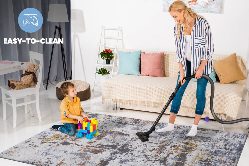 Ivory and navy abstract area rug from Anthony & Home's Loom and Luxe Collection, showcasing a modern design and soft texture.
