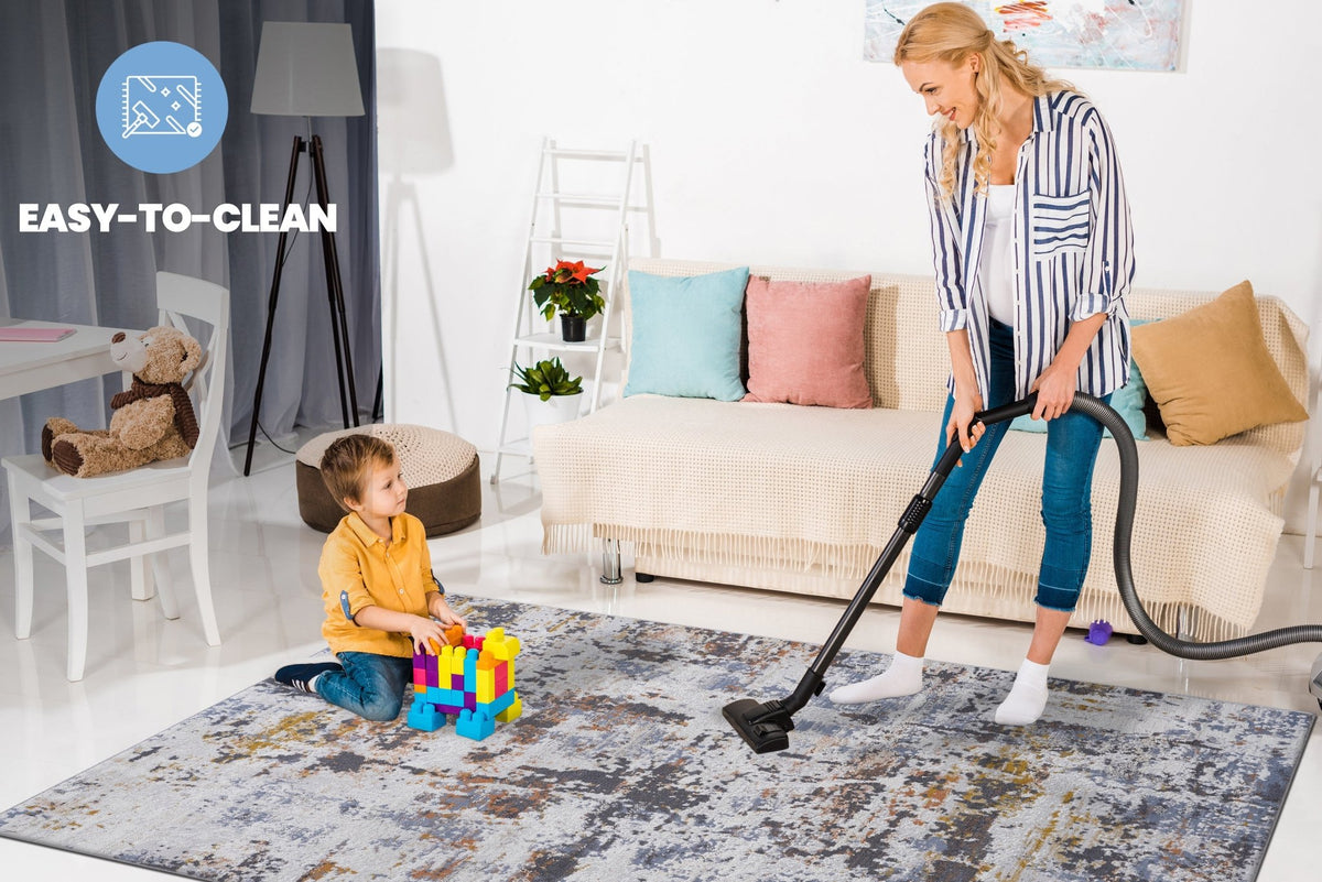 Ivory and navy abstract area rug from Anthony & Home's Loom and Luxe Collection, showcasing a modern design and soft texture.