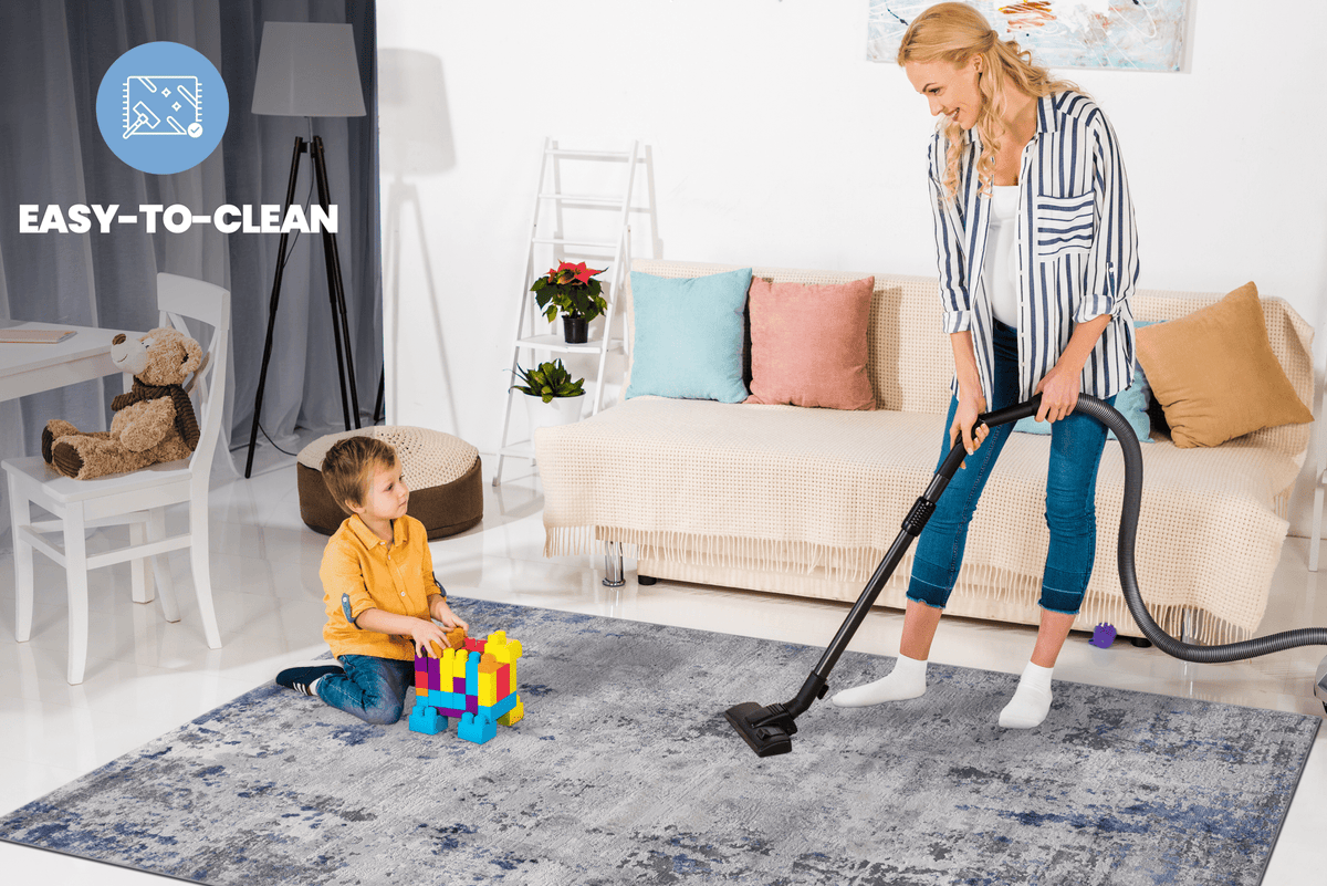 Anthony & Home Loom and Luxe Signature Area Rug with silver abstract polyester design on a neutral floor.