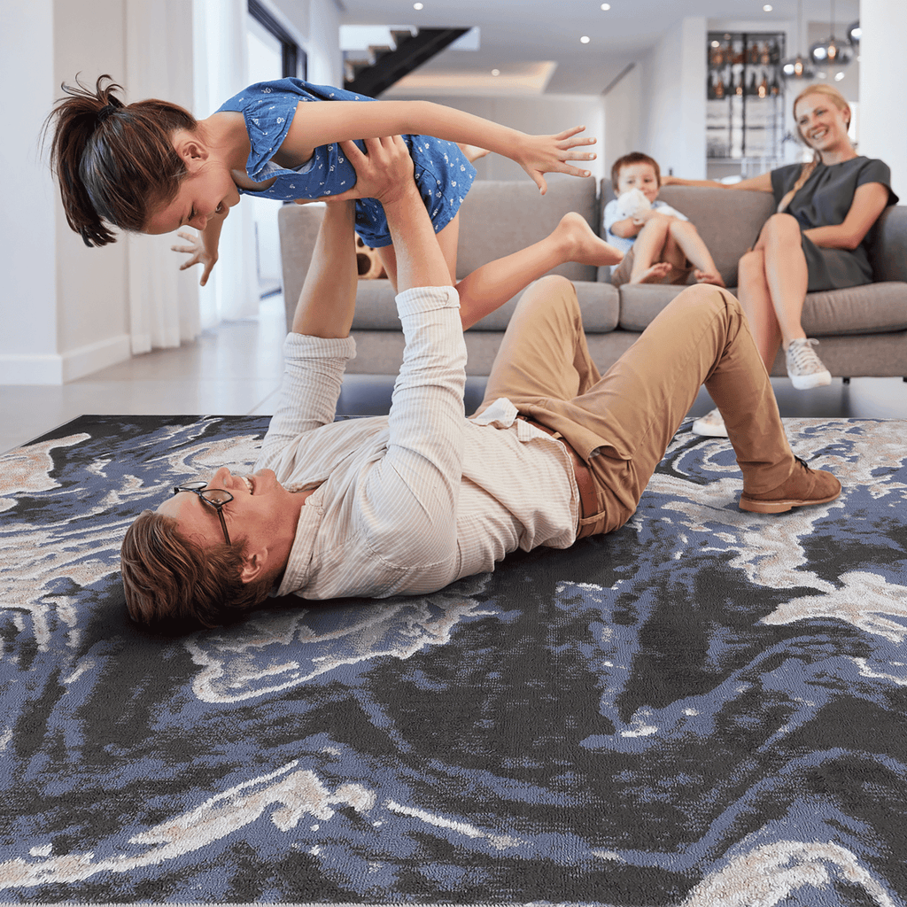 Light blue abstract area rug from Loom And Luxe Signature collection by Anthony & Home, showcasing a modern, soft-toned design.