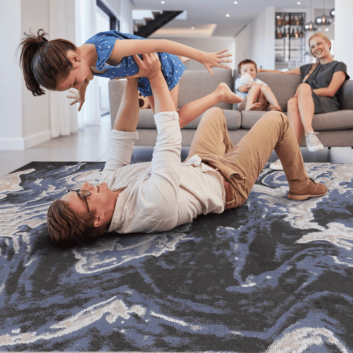 Light blue abstract area rug from Loom And Luxe Signature collection by Anthony & Home, showcasing a modern, soft-toned design.