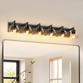 Matte black iron vanity light with glass shade from Anthony & Home, wall-mounted lighting fixture for bathroom or vanity area.