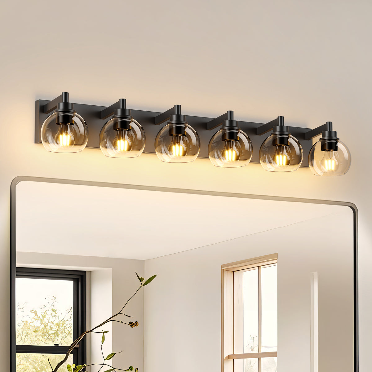 Matte black iron vanity light with glass shade from Anthony & Home, wall-mounted lighting fixture for bathroom or vanity area.