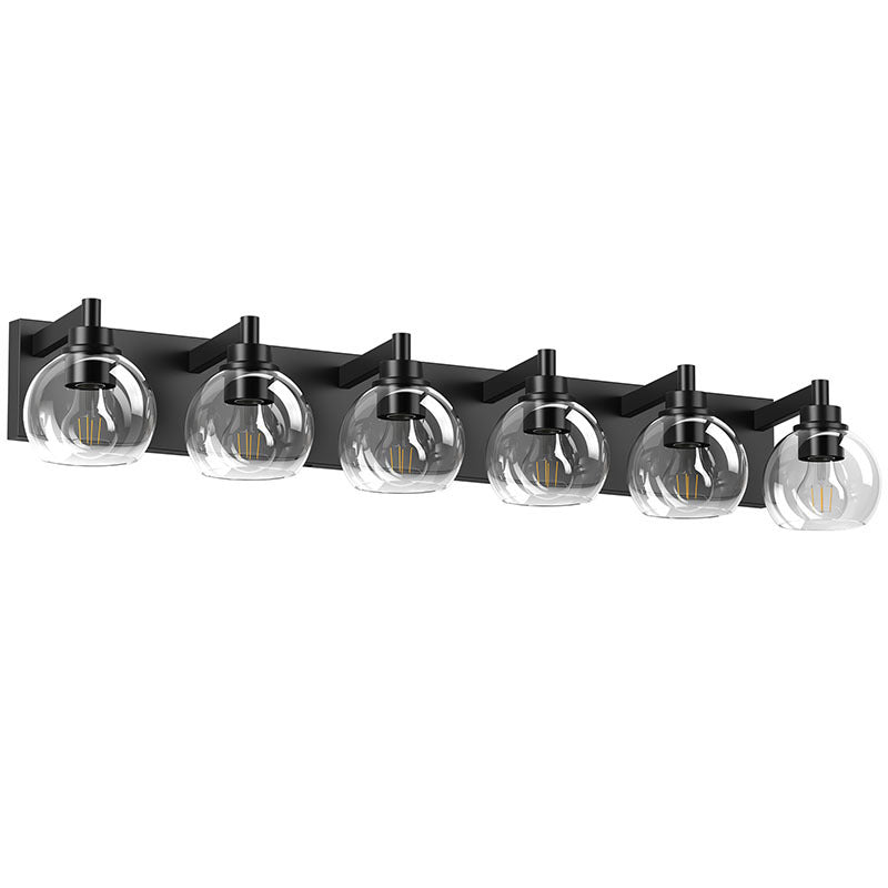 Matte black iron vanity light with glass shade from Anthony & Home, mounted on a wall, showcasing its sleek and modern design.
