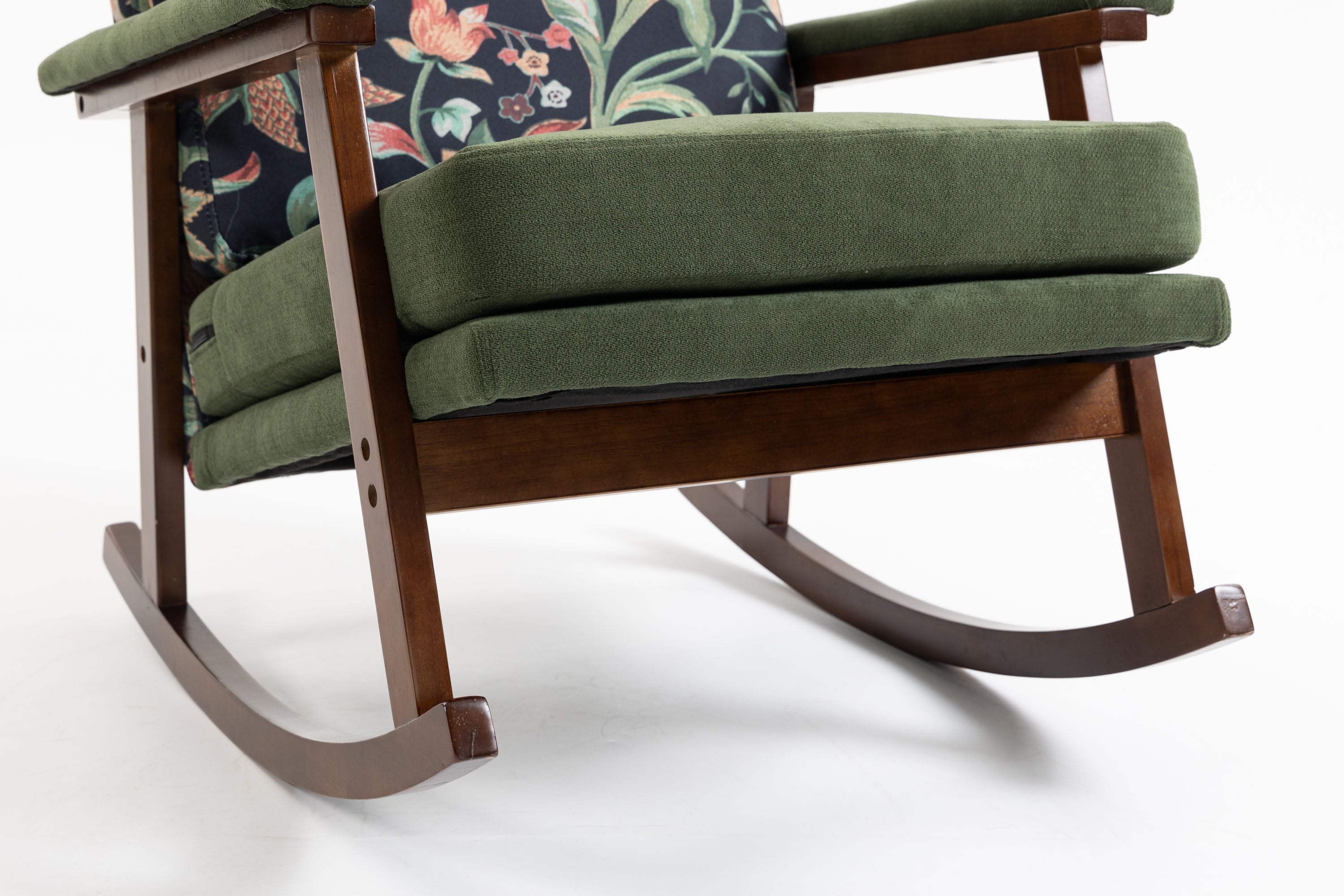 Mid-century modern walnut frame studio rocking chair by Anthony & Home, showcasing sleek design and comfortable wooden armrests.