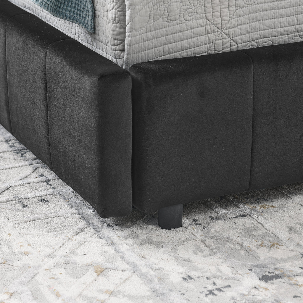 Velvet tufted full-size bed frame by Anthony & Home featuring a mid-century design with a padded headboard and sleek wooden legs.