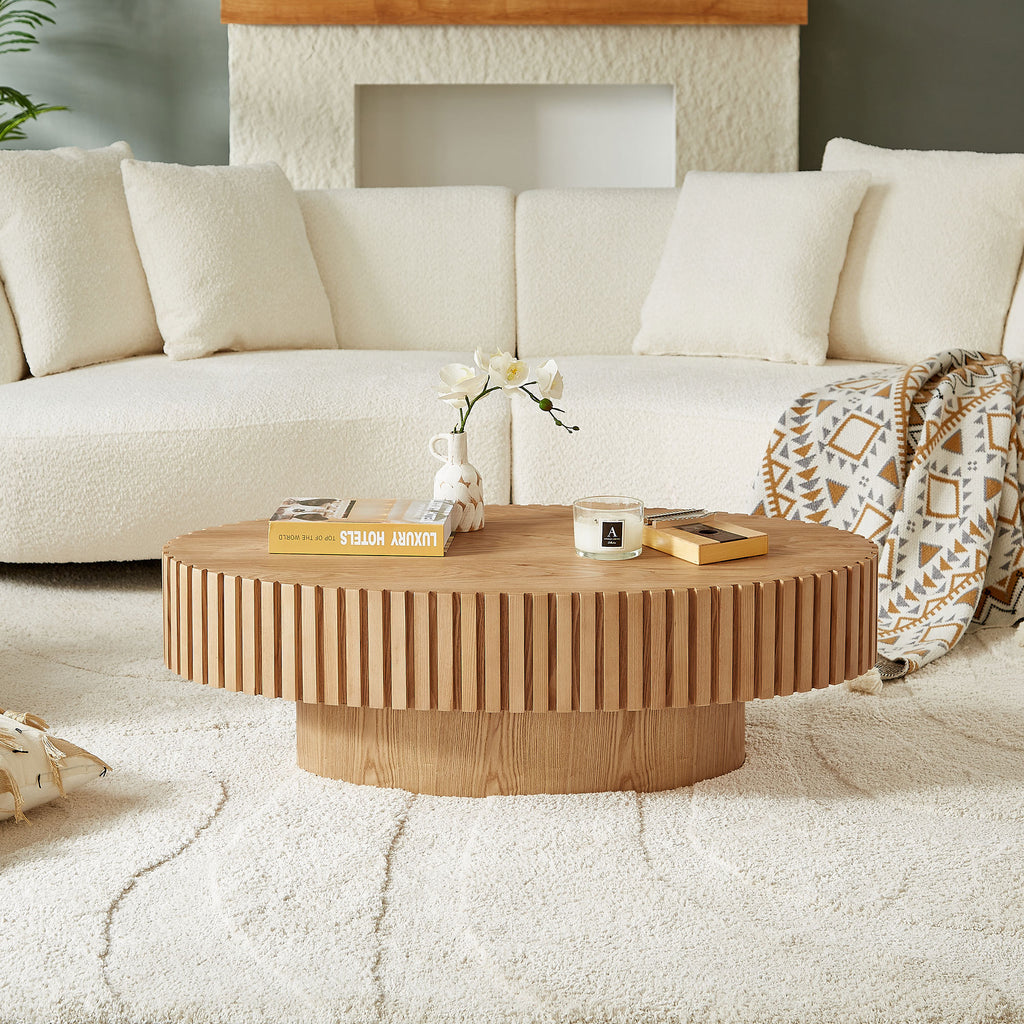 Natural ash drum coffee table with an elliptical shape by Anthony & Home, showcasing smooth wooden surface and modern design.