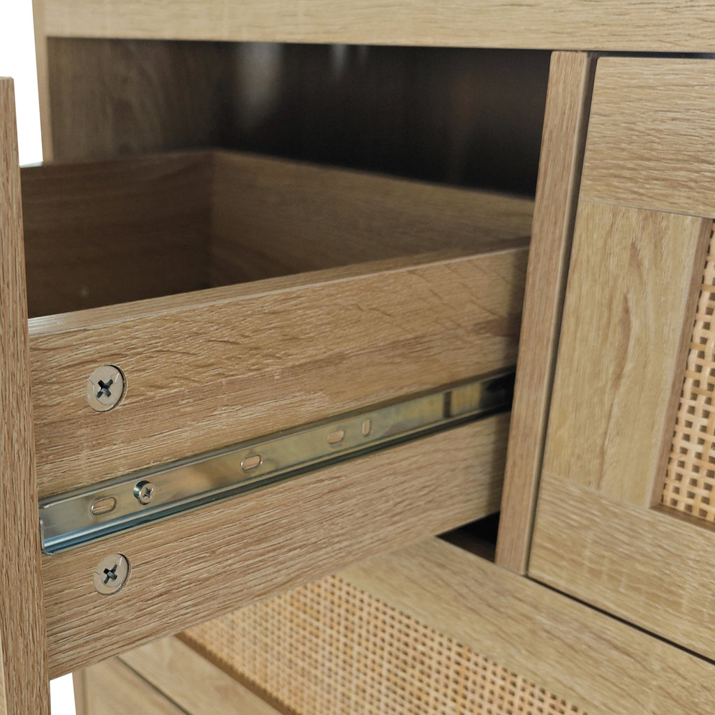 Natural rattan cabinet with four drawers from Anthony & Home's Atelier Collection, showcasing woven rattan doors and wooden frame.