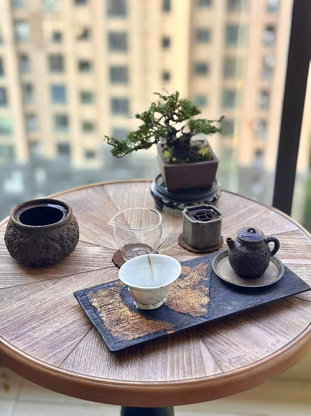 Natural wood tone round end table by Anthony & Home, featuring a sleek wooden surface and modern design for living spaces.