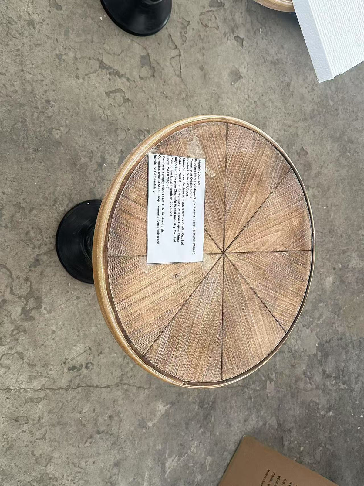 Natural wood tone round end table by Anthony & Home, showcasing a smooth wooden surface and sleek modern design.