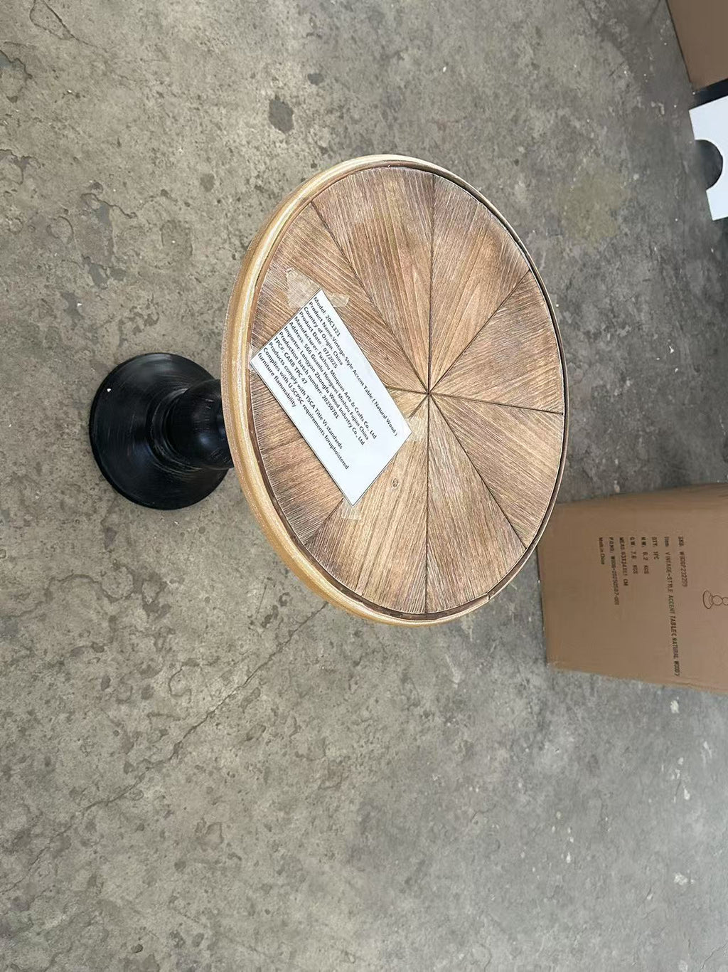 Natural wood tone round end table by Anthony & Home featuring a sleek wooden surface and modern design.