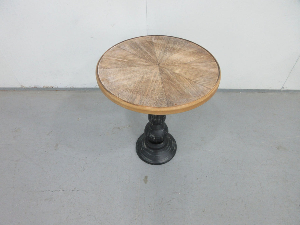 Natural wood tone round end table by Anthony & Home, Atelier collection, with smooth wooden surface and sleek round design.