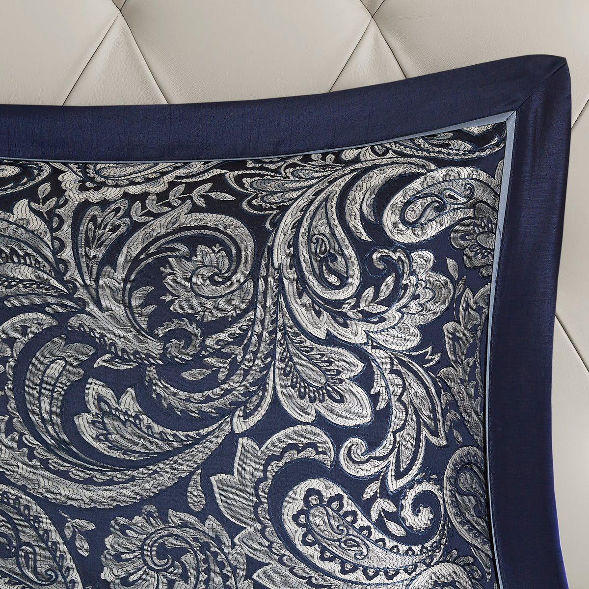 Navy Jacquard Cotton 12-piece Atelier Comforter Set by Anthony & Home with intricate pattern and matching pillow shams on a bed.