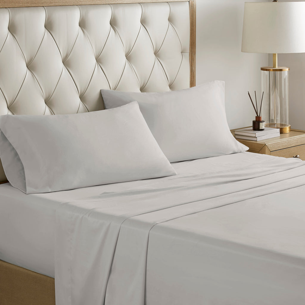 Navy jacquard cotton 12-piece Atelier Comforter Set by Anthony & Home with matching pillow shams and decorative bedding.