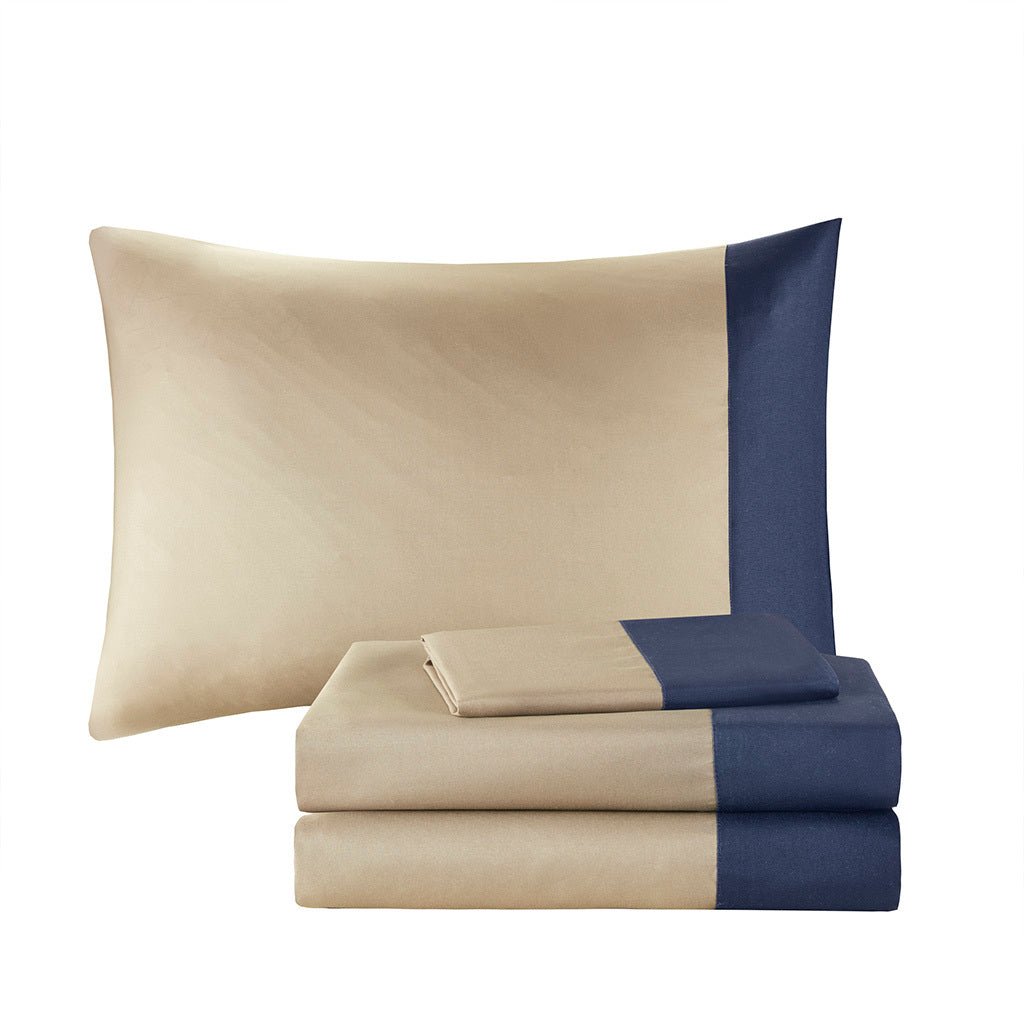 Navy Twin XL brushed microfiber comforter set by Anthony & Home with matching pillow shams on a bed.