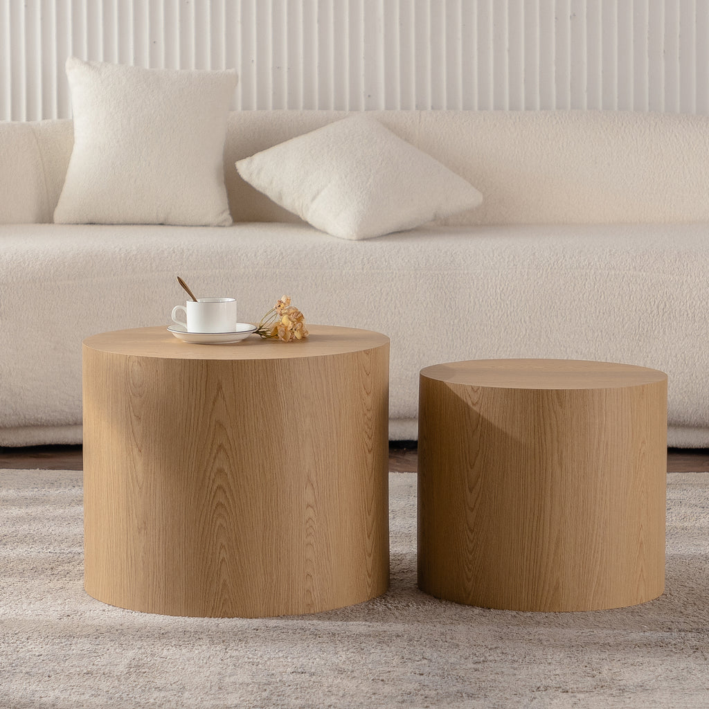 Set of nesting round coffee tables by Anthony & Home featuring sleek wooden tops and modern design.