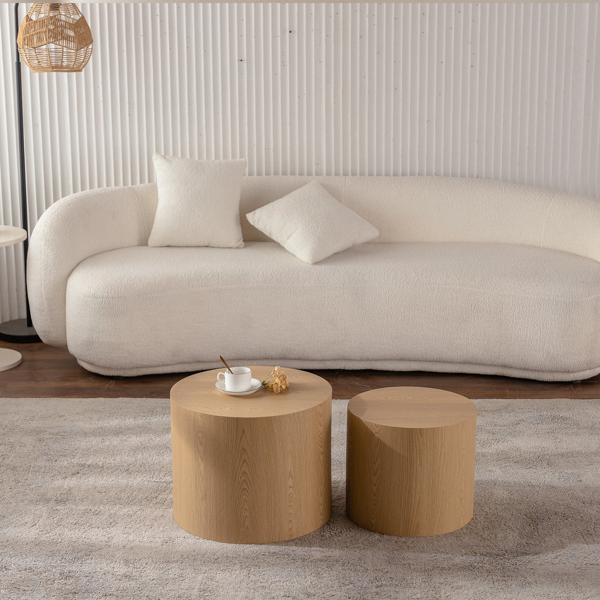 Set of two Anthony & Home nesting round coffee tables with wooden tops and black metal legs, ideal for modern living rooms.