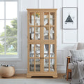 Oak curio cabinet with glass doors by Anthony & Home, showcasing shelves and elegant wooden frame for display storage