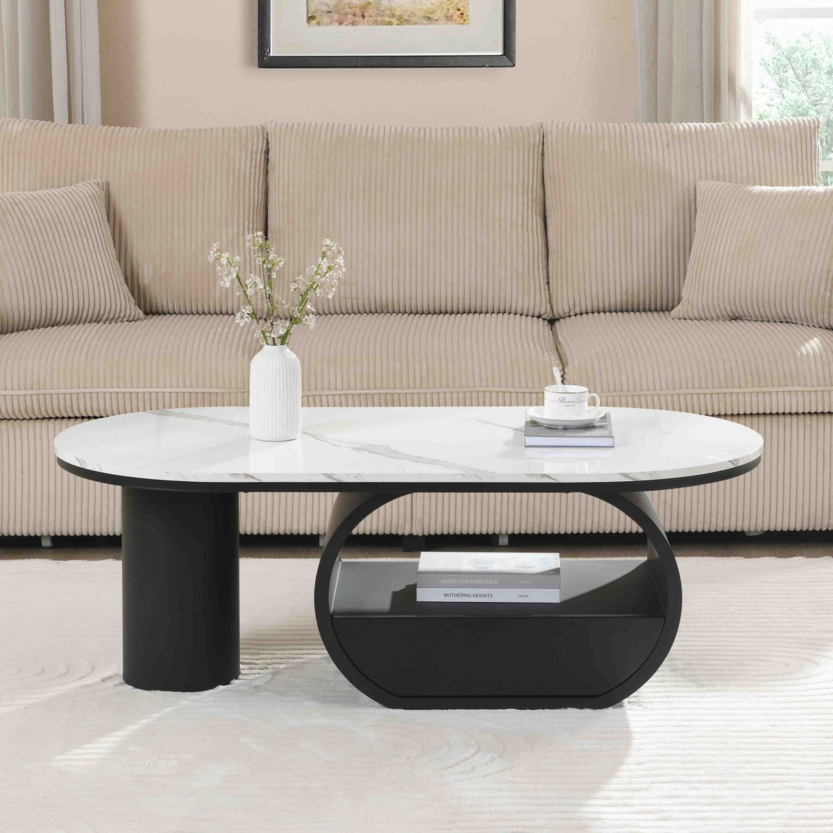 Oval coffee table with faux marble top and black metal frame, modern studio style from Anthony & Home