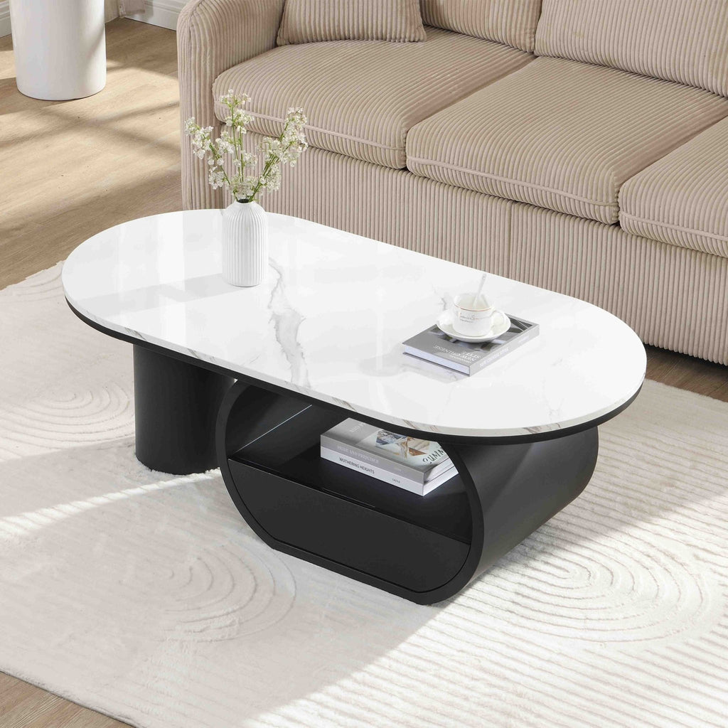 Oval coffee table with faux marble top and black metal frame, modern studio design by Anthony & Home
