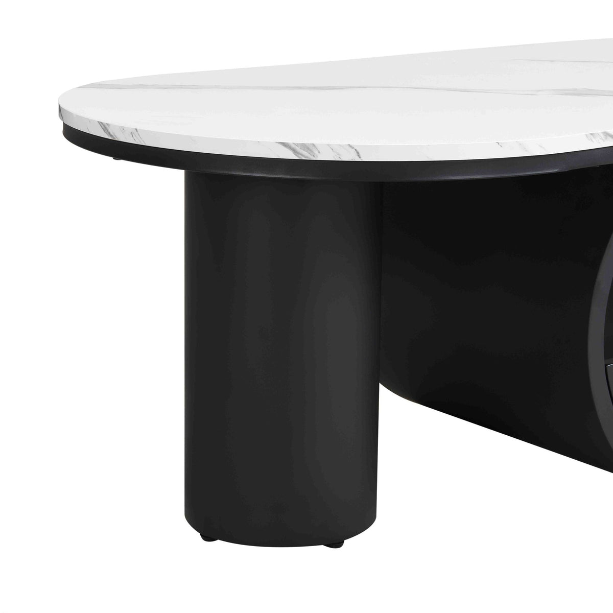 Oval coffee table with faux marble top and black metal frame by Anthony & Home in a studio setting