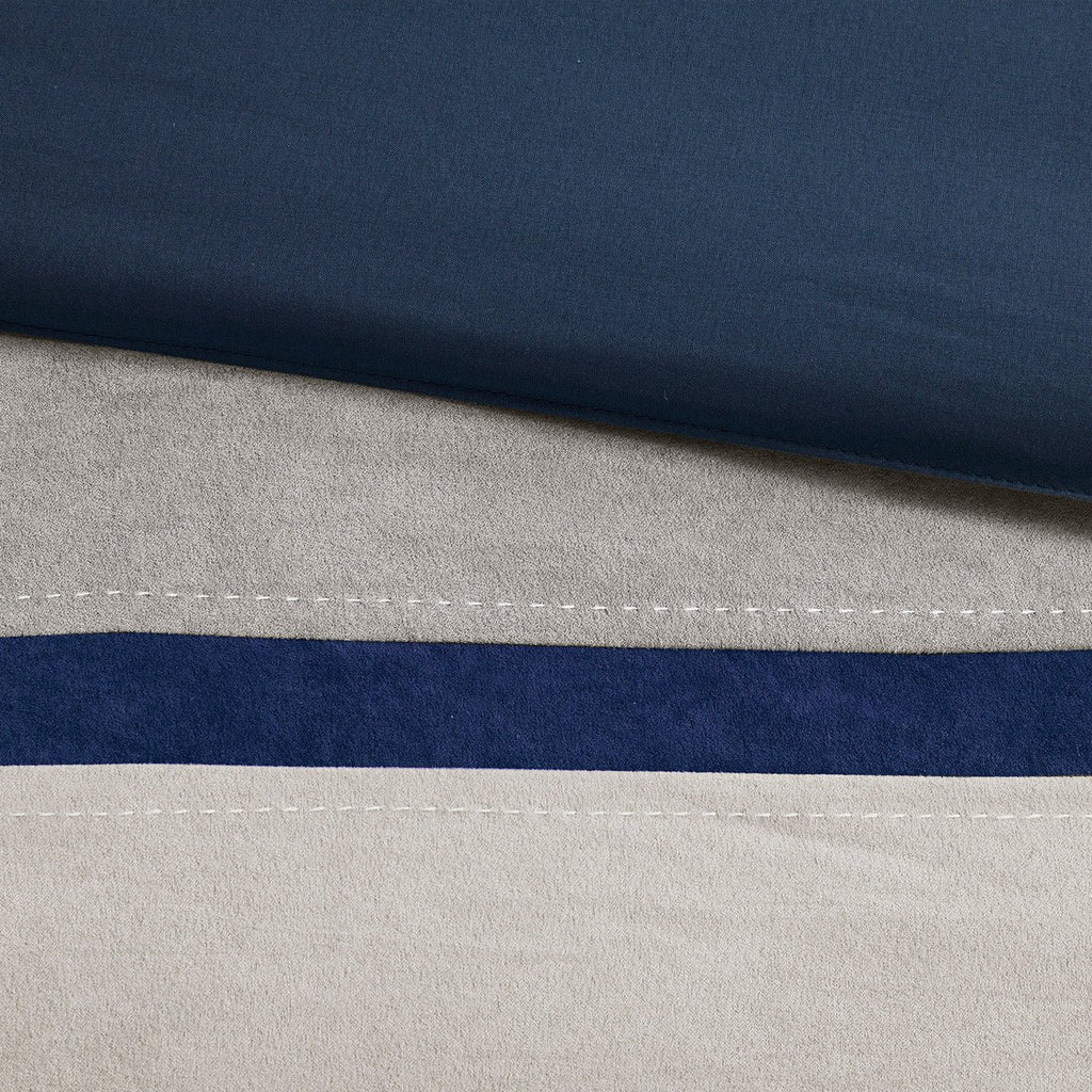 King blue faux suede comforter set by Anthony & Home featuring a 7-piece limited edition bedding with timeless craftsmanship.