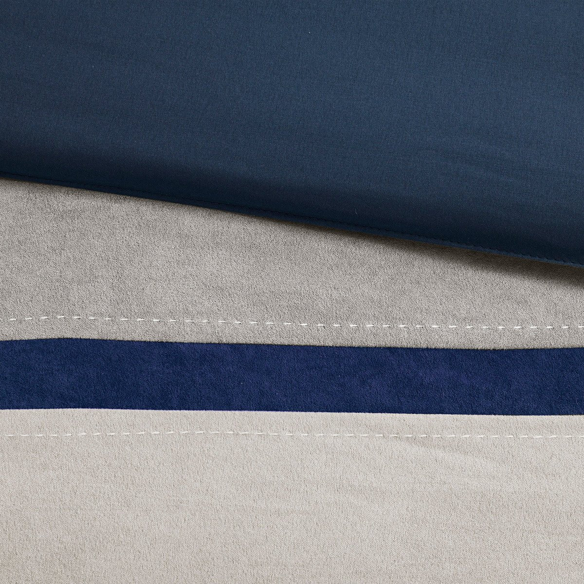 King blue faux suede comforter set by Anthony & Home featuring a 7-piece limited edition bedding with timeless craftsmanship.