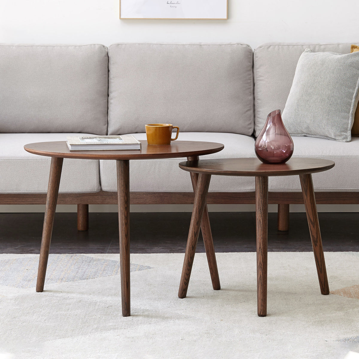Pebble-shaped coffee table with walnut finish, mid-century modern style, limited edition by Anthony & Home, showing smooth rounded surface.