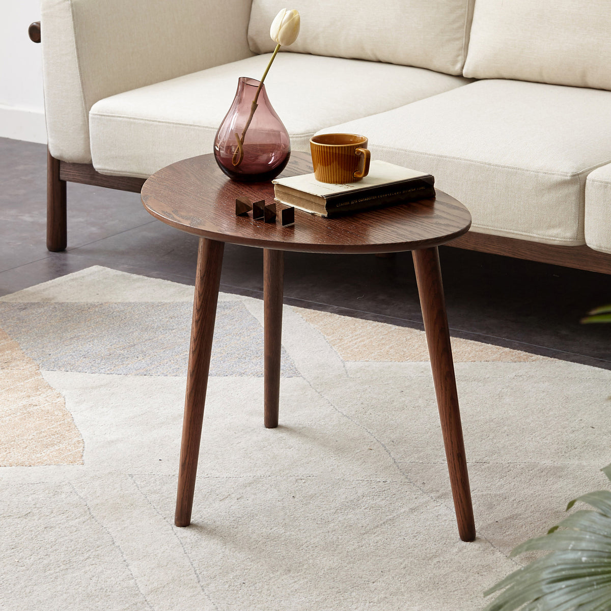 Pebble-shaped coffee table with walnut finish, mid-century modern design by Anthony & Home, limited edition decorative furniture piece.