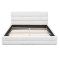 Queen platform bed by Anthony & Home with white velvet upholstery and wood frame, featuring a modern and elegant design.